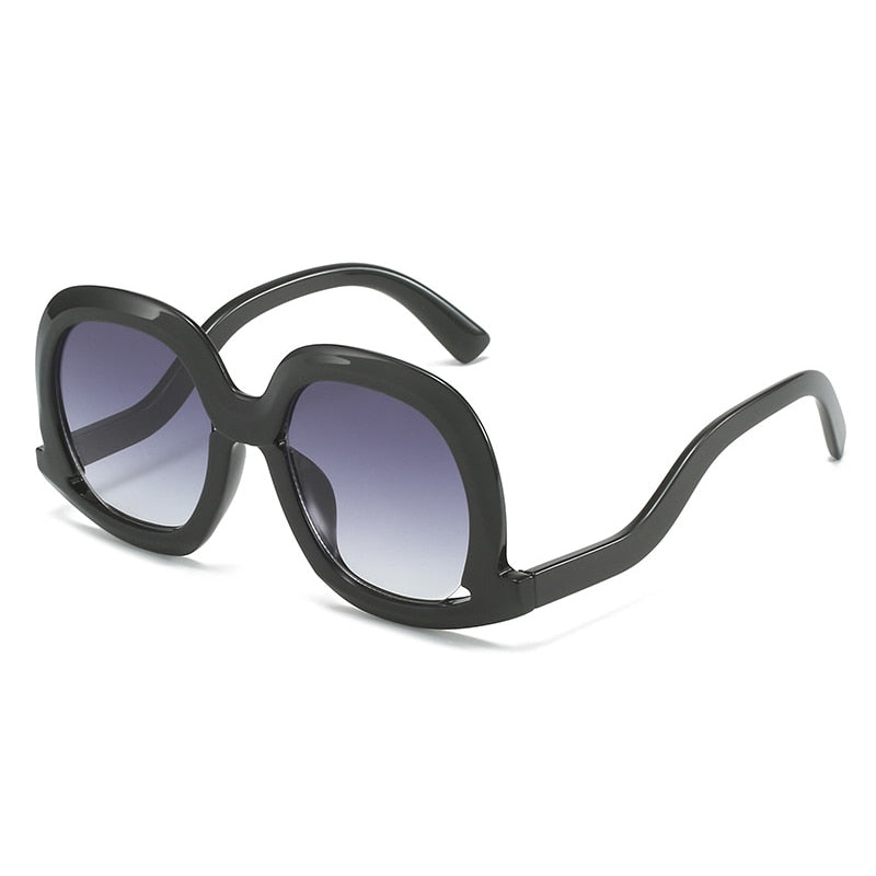 Gafas de sol ovaladas únicas de moda para mujer, gafas de sol huecas de tendencia con degradado de leopardo colorido para hombre y mujer con protección UV400 