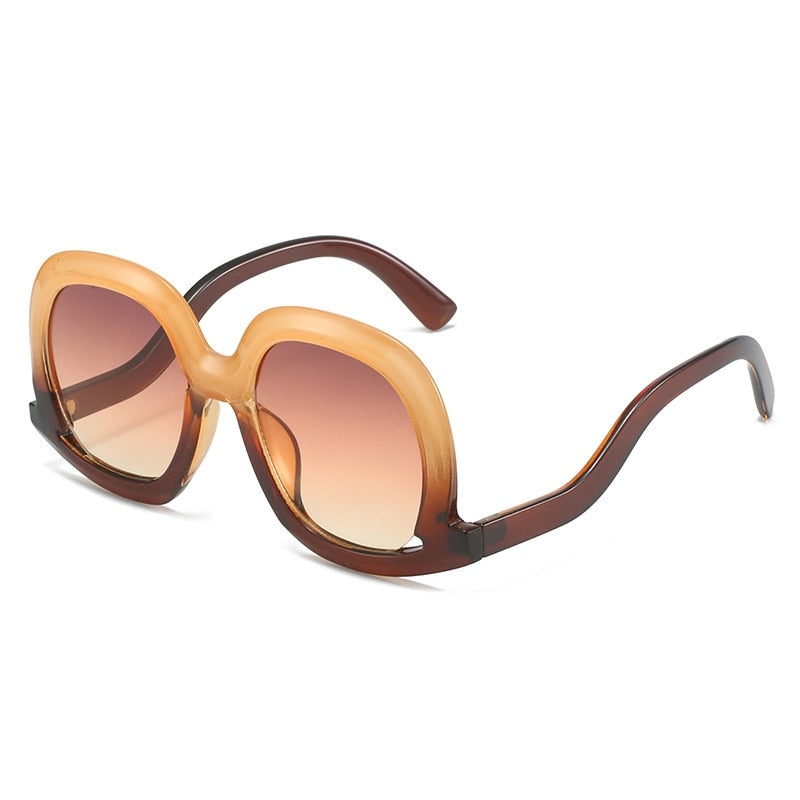 Gafas de sol ovaladas únicas de moda para mujer, gafas de sol huecas de tendencia con degradado de leopardo colorido para hombre y mujer con protección UV400 