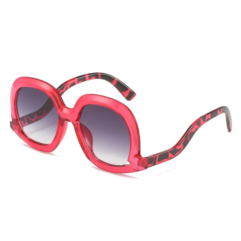 Gafas de sol ovaladas únicas de moda para mujer, gafas de sol huecas de tendencia con degradado de leopardo colorido para hombre y mujer con protección UV400 