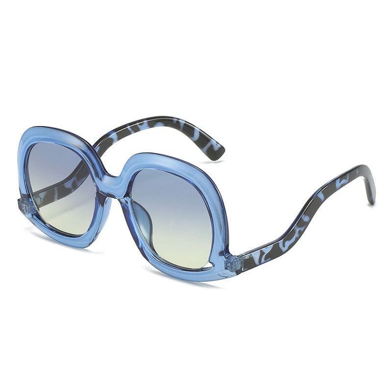 Gafas de sol ovaladas únicas de moda para mujer, gafas de sol huecas de tendencia con degradado de leopardo colorido para hombre y mujer con protección UV400 